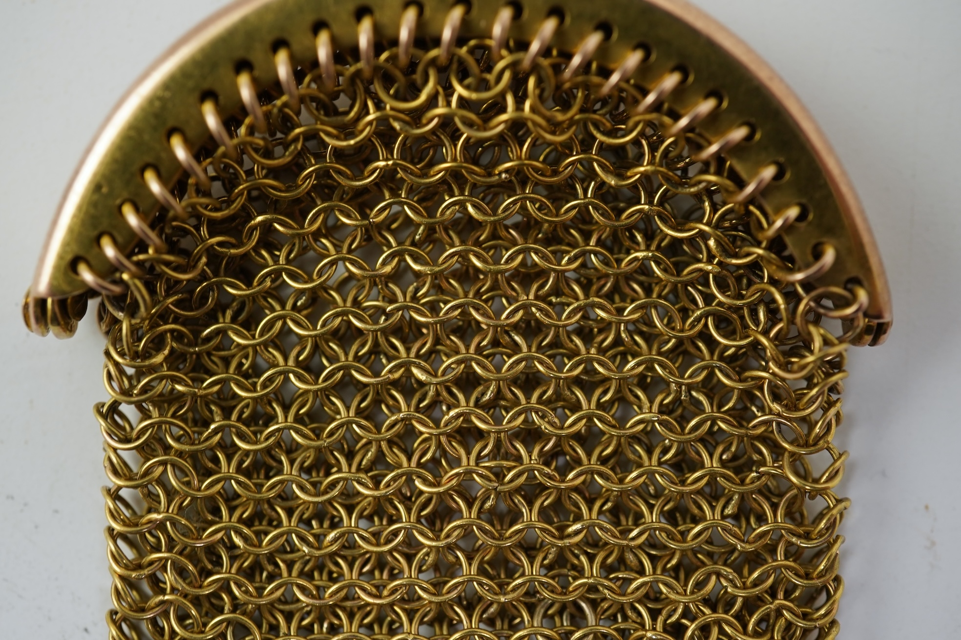 A small early 20th century 9ct gold mesh purse
